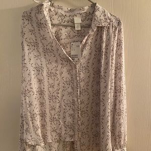 Long sleeve button down collared blouse.